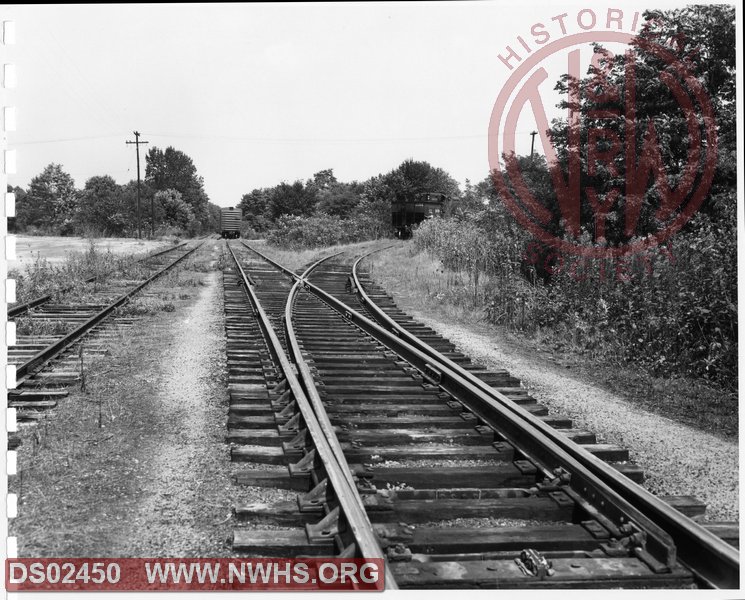 N&W: Radford yard:Main track Radford Branch and siding showing switch leading to Central Lumber Company and various Oil Company sidings, looking east.