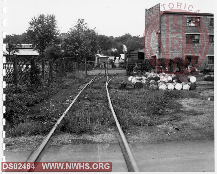N&W: Pulaski yard:Looking East on Rolling Mill Spur in Coleman Furniture Plant No. 1, showing Pulaski Furniture Company and switch-back to Coleman Plant No. 2