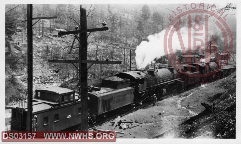 VGN steam pushers with Caboose 45 taking on water at Herndon, WV. Possibly Class AE